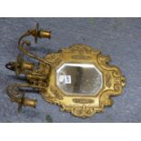 A SET OF FOUR ORMOLU THREE CANDLE GIRANDOLE MIRRORS, THE CANTED RECTANGULAR PLATES IN FRAMES