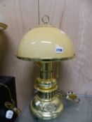 AN SS GRAND RIVER, ST LOUIS BRASS TABLE LAMP WITH DOMED OCHRE GLASS SHADE. H 53cms.