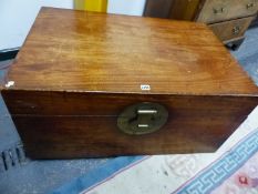 A CHINESE HARDWOOD TRUNK WITH BRASS HANDLES AND CIRCULAR LOCK PLATE. W 95 x D 62 x H 44.5cms.