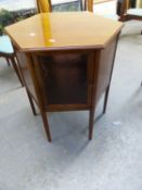 AN ARTS AND CRAFTS MAHOGANY HEXAGONAL TABLE TOPPED CABINET, THE TWO DOORS TO THE APRON COMPARTMENT