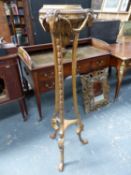 A NEO CLASSICAL STYLE GILTWOOD TORCHERE STAND WITH RAMS HEAD MASKED DECORATION. H.133cms.