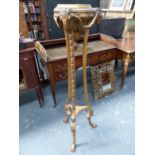 A NEO CLASSICAL STYLE GILTWOOD TORCHERE STAND WITH RAMS HEAD MASKED DECORATION. H.133cms.