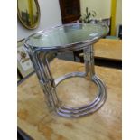 A NEST OF THREE CIRCULAR GLASS TOPPED COFFEE TABLES, EACH WITH CHROME TUBULAR SUPPORTS. Dia. 43 x