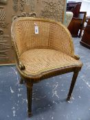 A SMALL FRENCH GILTWOOD CANE SEATED STOOL ON TURNED FLUTED LEGS.