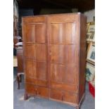 ATTB. PETER WAALS (1870-1937) AN ARTS AND CRAFTS HAND MADE OAK CUPBOARD/ WARDROBE WITH SHAPED