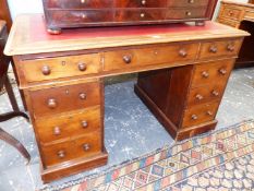 A VICTORIAN MAHOGANY TWIN PEDESTAL WRITING DESK WITH ARRANGEMENT OF NINE DRAWERS STANDING ON