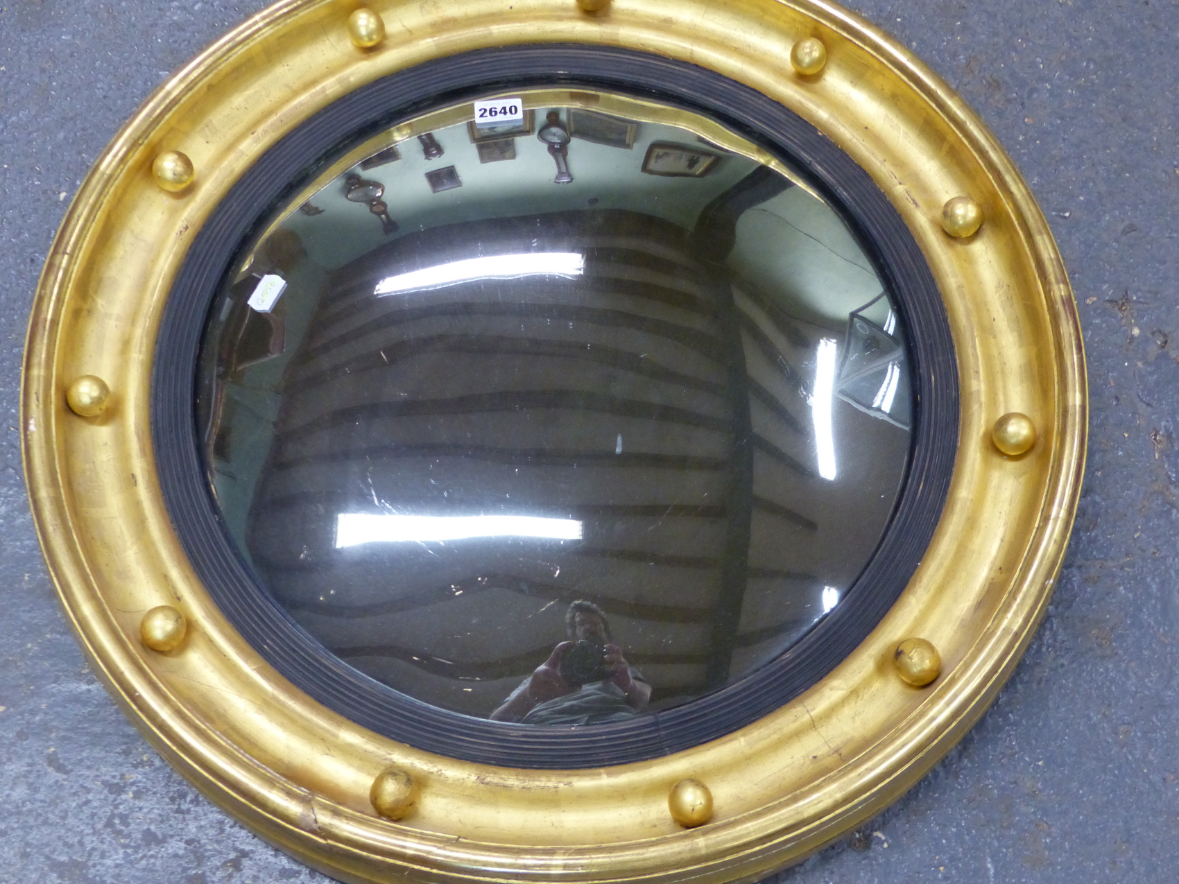 A CONVEX MIRROR WITHIN REEDED SLIP AND BEADED GILT FRAME SURMOUNTED BY AN EAGLE. H 90 x Dia. 63cms. - Image 6 of 13