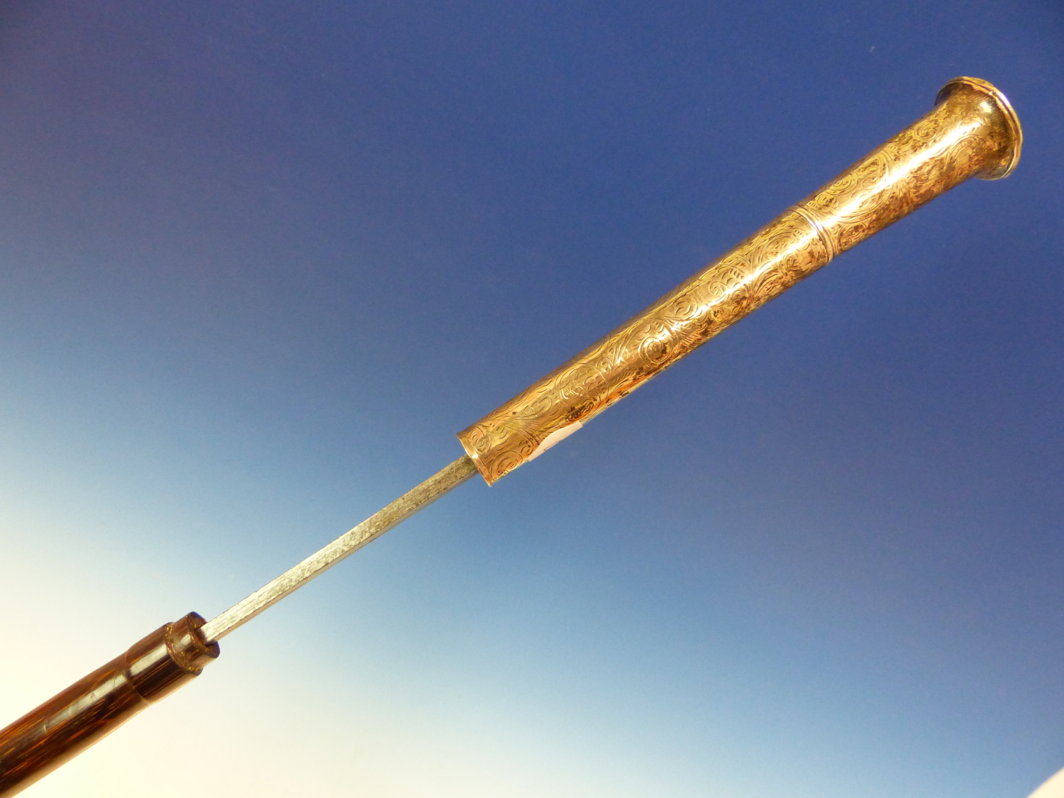 A LONDON SILVER HANDLED SWORD STICK, THE CANE SCABBARD HOUSING A BLADE OF SQUARE SECTION.