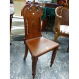 A LATE VICTORIAN CARVED OAK HALL CHAIR, TURNED FRONT LEGS.