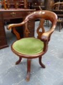 A LATE VICTORIAN MAHOGANY SWIVEL DESK CHAIR.