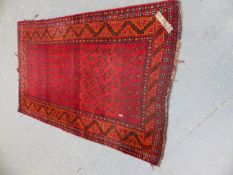 A PERSIAN TRIBAL RUG 139 x 230cms.