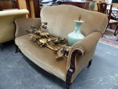 A LATE VICTORIAN CARVED MAHOGANY SETTEE WITH SHAPED BACK AND SCROLL ARMS. W. 156cms.