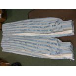A PAIR OF PALE BLUE STRIPE PATTERN LINED AND INTERLINED CURTAINS.