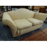 AN ANTIQUE TWO SEAT SETTEE WITH SHAPED BACK AND SPLAY ARMS. W.200cms.