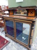 A LATE 19th.C.AESTHETIC MOVEMENT EBONY AND FIGURAL AMBOYNA CABINET WITH TWO GLAZED DOORS AND
