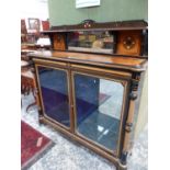 A LATE 19th.C.AESTHETIC MOVEMENT EBONY AND FIGURAL AMBOYNA CABINET WITH TWO GLAZED DOORS AND