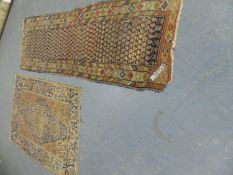 AN ANTIQUE PERSIAN SAROUK RUG, TOGETHER WITH AN ANTIQUE PERSIAN TRIBAL RUNNER 307 x 100cms (2).