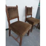 A PAIR OF VICTORIAN GOTHIC REVIVAL HALL CHAIRS WITH CARVED FORELEGS AND STRETCHERS.