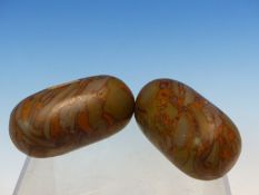 TWO INDIAN RIVER POLISHED OCHRE BRECCIATED GREEN LINGAM STONES. W 6.5cms.