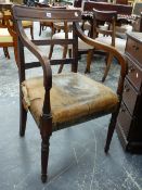 A REGENCY MAHOGANY ARMCHAIR ON TURNED REEDED LEGS AND LEATHER UPHOLSTERED SEAT.