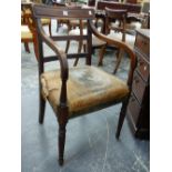A REGENCY MAHOGANY ARMCHAIR ON TURNED REEDED LEGS AND LEATHER UPHOLSTERED SEAT.