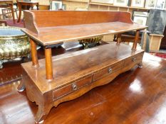 AN ANTIQUE AND LATER MAHOGANY BOOKSTAND WITH A THREE DRAWER FITTED BASE. W.83 x D.25 x H.39cms.