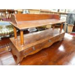 AN ANTIQUE AND LATER MAHOGANY BOOKSTAND WITH A THREE DRAWER FITTED BASE. W.83 x D.25 x H.39cms.