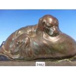 PAULINE BOUMPHREY. 1886-1959, BRONZE GROUP OF TWO SLEEPING SPANIEL PUPPIES ON RECTANGULAR POLISHED