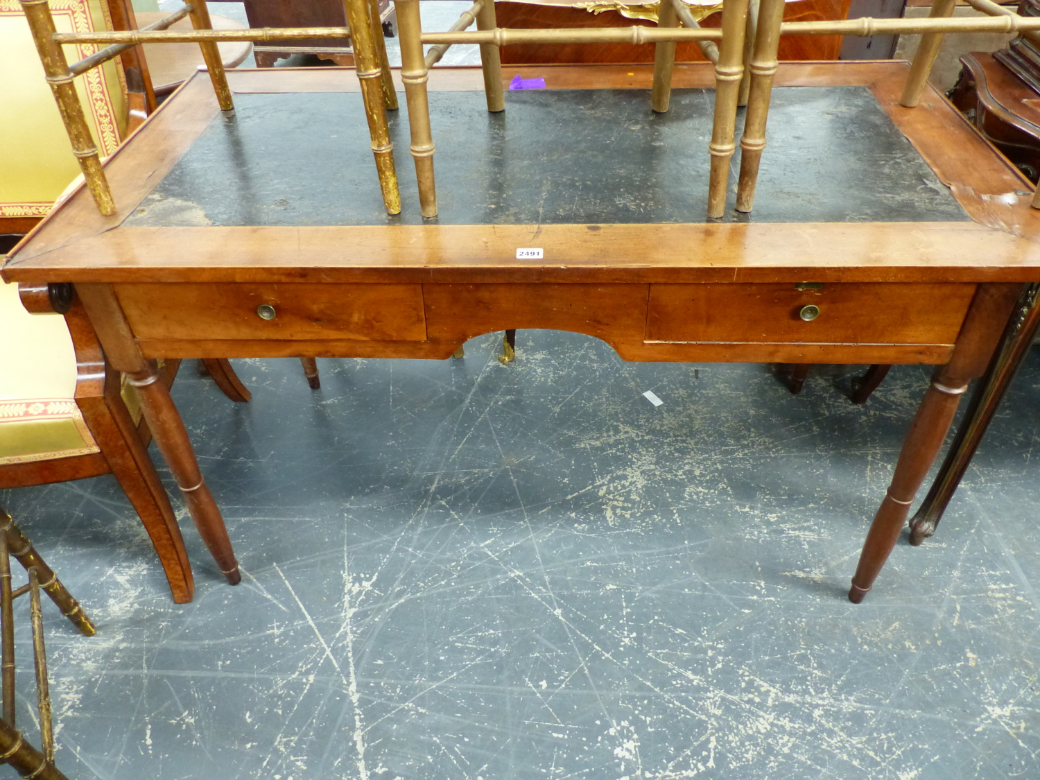 A 19th.C.FRENCH PROVINCIAL WALNUT WRITING TABLE ON TURNED LEGS, 131 x 68 x 74cms.