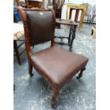 A CARVED WALNUT VICTORIAN NURSING CHAIR, SHORT TURNED FLUTED LEGS, WITH CASTERS.