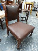 A CARVED WALNUT VICTORIAN NURSING CHAIR, SHORT TURNED FLUTED LEGS, WITH CASTERS.