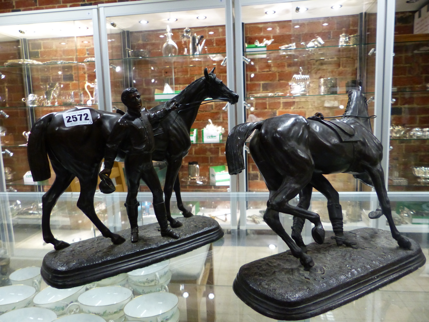 A PAIR OF 19TH CENTURY BRONZE PATINATED SPELTER FIGURE OF MARLEY HORSES