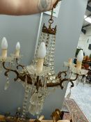 A SIX LIGHT GILT METAL AND CRYSTAL CHANDELIER IN THE FRENCH TASTE, TOGETHER WITH TWO FOLIATE FORM