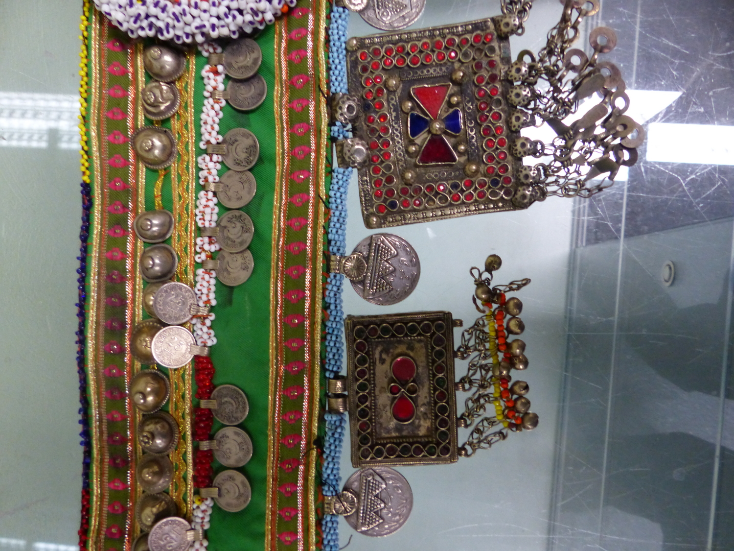 AN ISLAMIC BEADED TEXTILE BELT SEWN WITH 1990S TURKISH COINS AND HUNG WITH COLOURED PASTE MOUNTED - Image 3 of 7