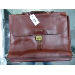 AN HERMES BROWN SOFT LEATHER BRIEF OR DOCUMENT CASE, THE FOLD OVER FLAP LOCKING THE THREE