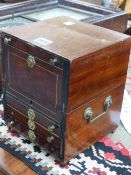 A BRASS HANDLED MAHOGANY STATIONERY BOX, THE EBONY STRUNG FRONT WITH A CONCEIT FALL OVER THREE