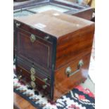 A BRASS HANDLED MAHOGANY STATIONERY BOX, THE EBONY STRUNG FRONT WITH A CONCEIT FALL OVER THREE