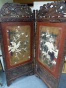 AN ORIENTAL TWO FOLD SCREEN WITH IVORY CARVED RELIEF PANELS OF BIRDS. OVERALL SIZE 154 x 183cms.