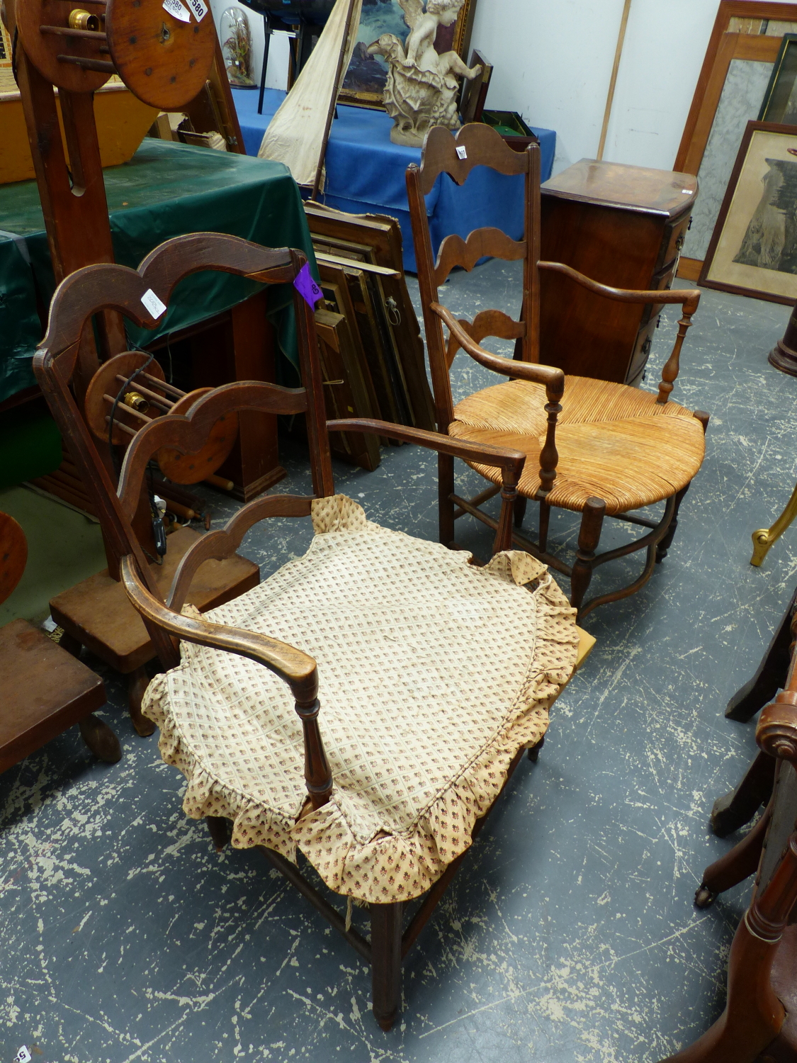 TWO FRENCH RUSH SEATED LADDER BACK ARMCHAIRS.