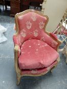 A LOUIS XV STYLE GREY PAINTED FAUTEUIL UPHOLSTERED IN PINK DAMASK.