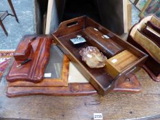 A LEATHER MOUNTED DESK SET, A WOODEN TRAY, TWO BOXES, A BLOTTER AND A MOTTLED BROWN STONE BOWL.