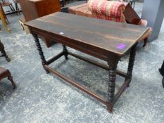 AN ANTIQUE CARVED OAK SIDE TABLE, RECTANGULAR TOP, STRETCHERED TURNED LEGS. H. 72 x W. 19cms.