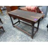 AN ANTIQUE CARVED OAK SIDE TABLE, RECTANGULAR TOP, STRETCHERED TURNED LEGS. H. 72 x W. 19cms.