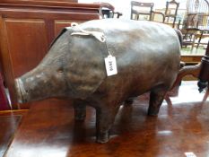 A LEATHER COVERED MODEL OF A PIG IN THE LIBERTY STYLE, STANDING FOUR SQUARE ON COPPER STUD BASED