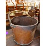 A COPPER CYLINDRICAL COAL BUCKET, TUBULAR HANDLE. Dia. 34cms.