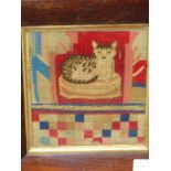 A BERLIN WOOL WORK PICTURE OF A CAT ON A CUSHION, THE ROSEWOOD FRAME. 28.5 x 26.5cms. TOGETHER