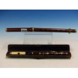 A CASED IVORY AND ROSEWOOD PICCOLO TOGETHER WITH ANOTHER SLIGHTLY LARGER IN ROSEWOOD