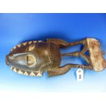 TWO CARVED AND DECORATED DECORATIVE AFRICAN TRIBAL MASKS. HEIGHT OF LARGEST 53cms.