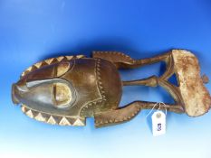 TWO CARVED AND DECORATED DECORATIVE AFRICAN TRIBAL MASKS. HEIGHT OF LARGEST 53cms.