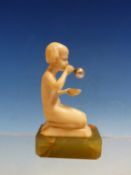 A FINE ART DECO CARVED IVORY FIGURE OF A CHILD BLOWING BUBBLES. MOUNTED ON GEEN MARBLE BASE 8CM
